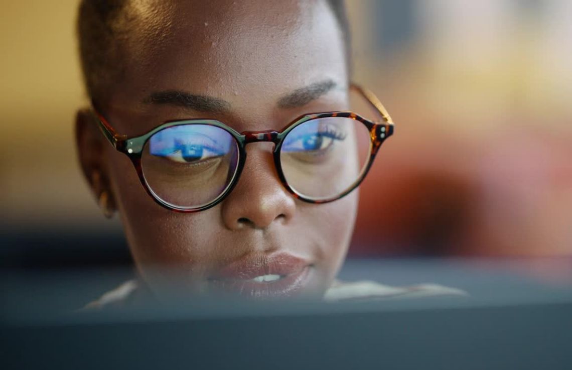 A woman uses a computer