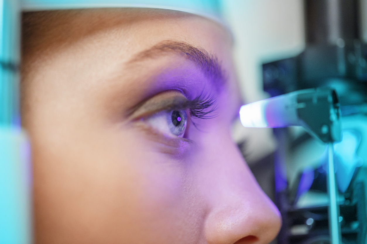 A picture of a person receiving and eye exam.