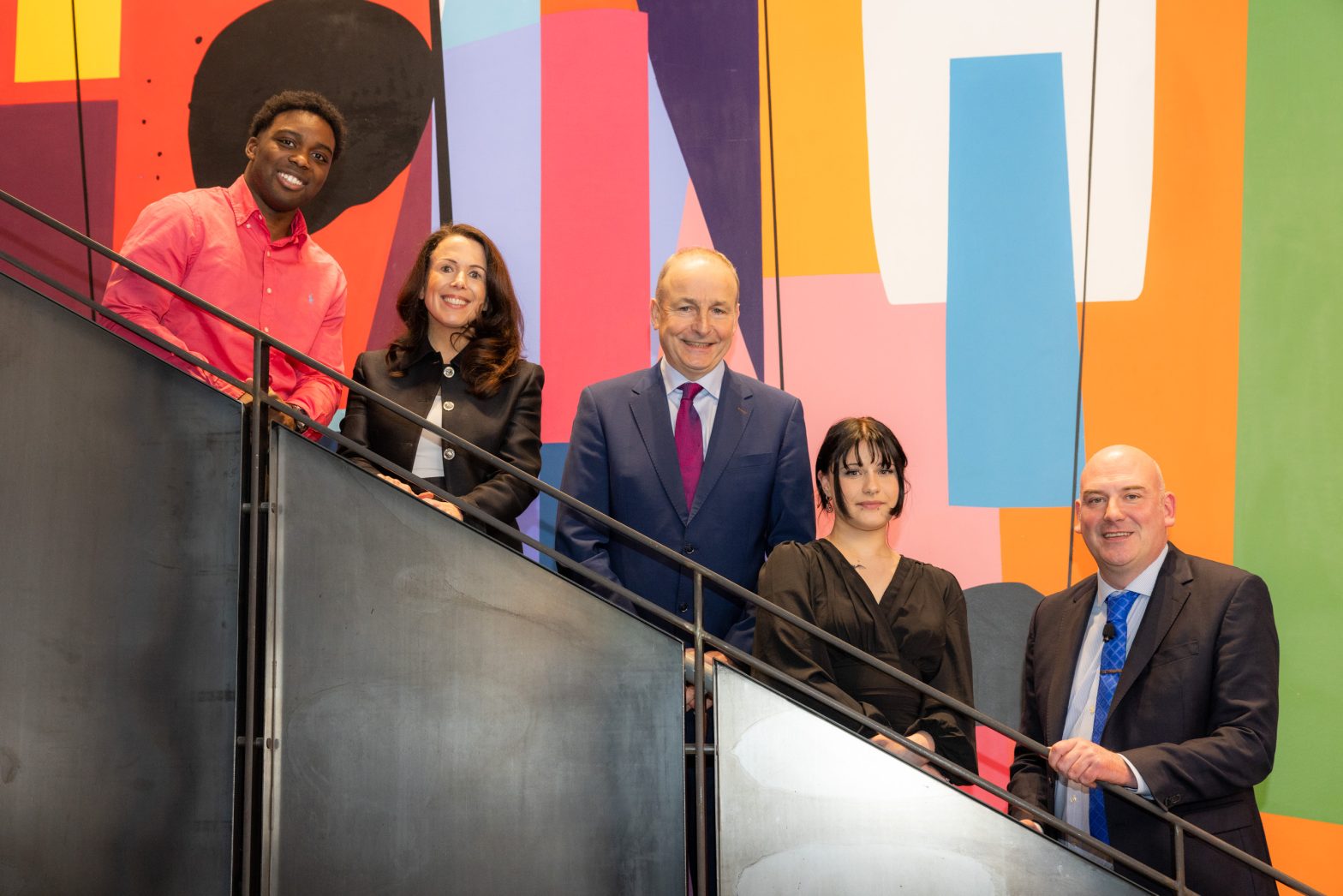 A picture of attendees at the launch of the Insight Google AI Scholarship (l-r): Raphael Junior Okafor, student, Vanessa Hartley, Head of Google Ireland, Taoiseach Micheál Martin TD, Amber Mullen Williams, student, and Prof Noel O’Connor, Director of the Insight Research Ireland Centre. Image by Naoise Culhane Photography.